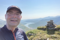 Summit of Beinn Tharsuinn with Loch Monar behind.